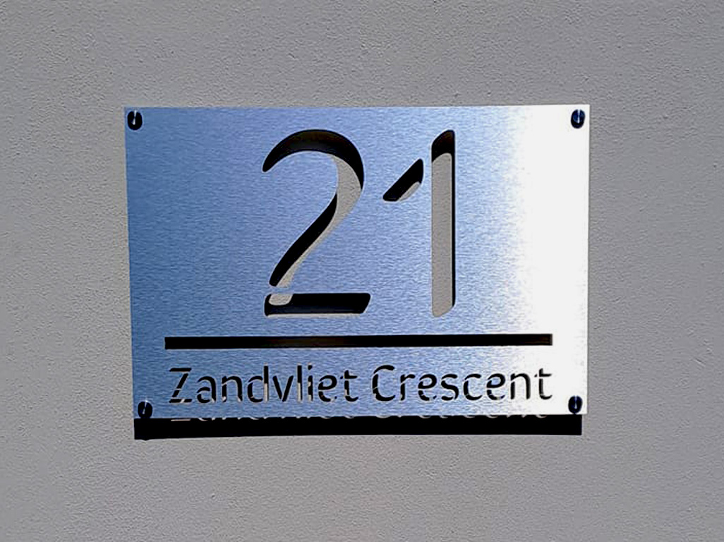 Fiber laser cutting galvanized steel signs